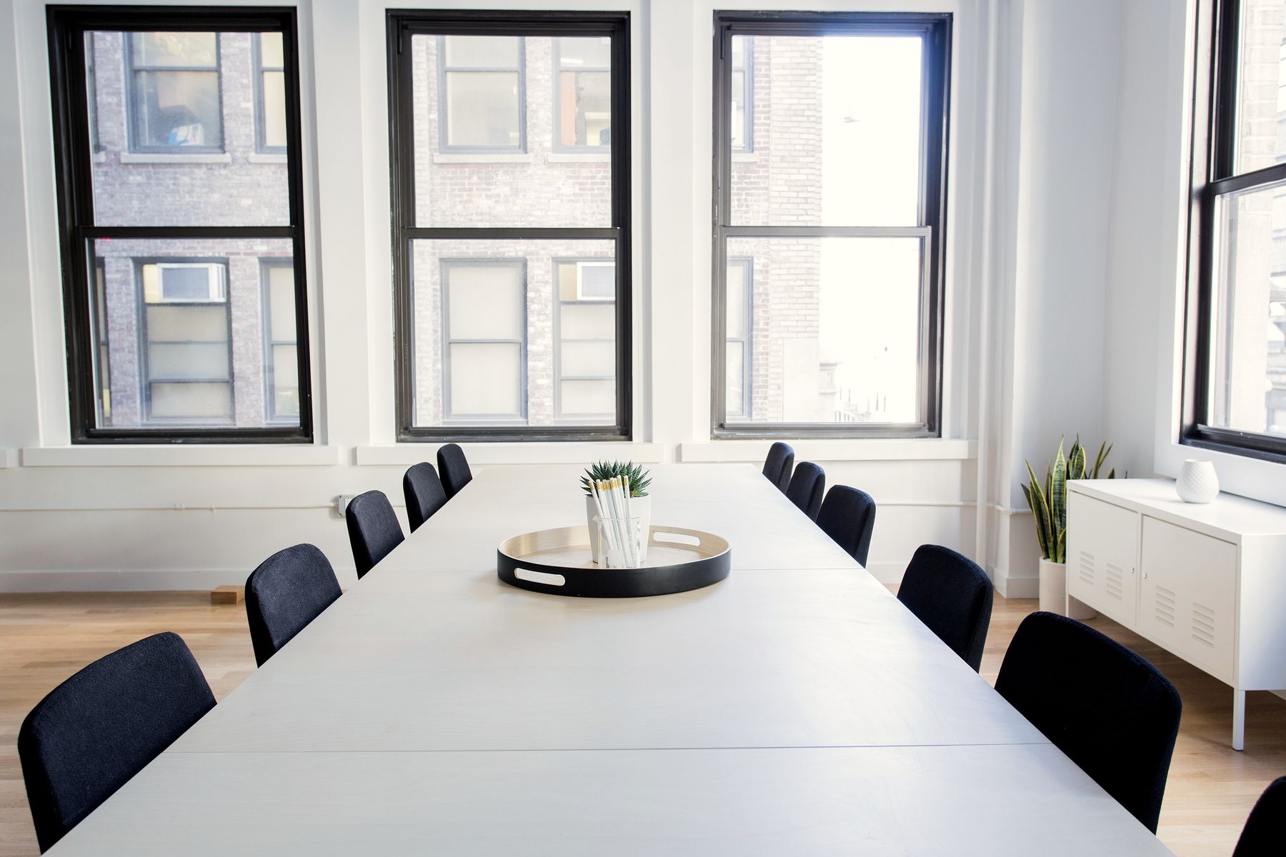 A meeting room with a long table